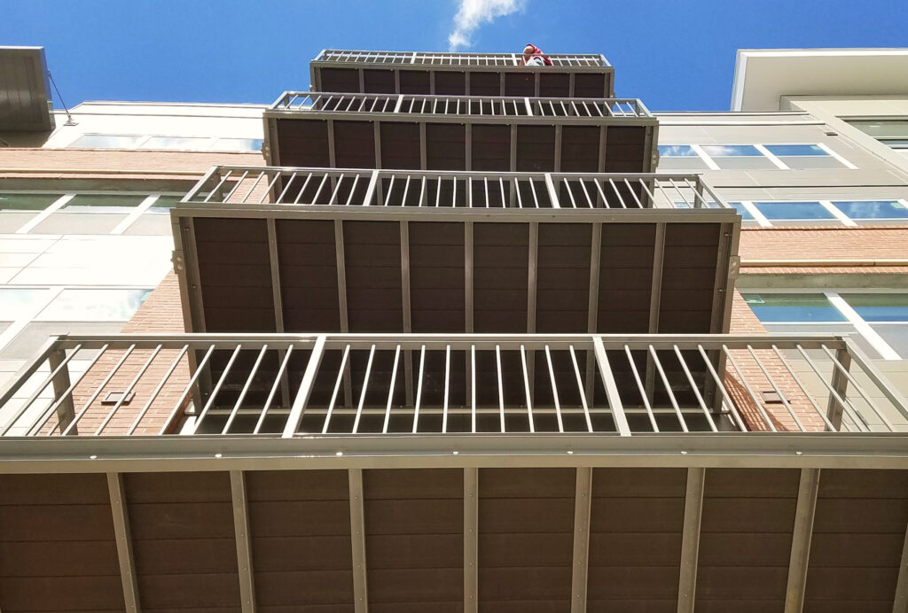 Commercial DuxxBak composite decking installed on an apartment building