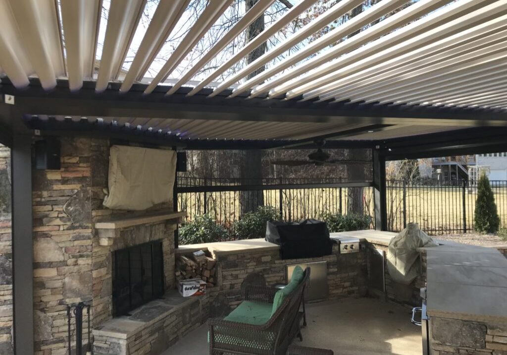 Bronze louvered pergola with tan louvers open and Rainier powered screens on all sides